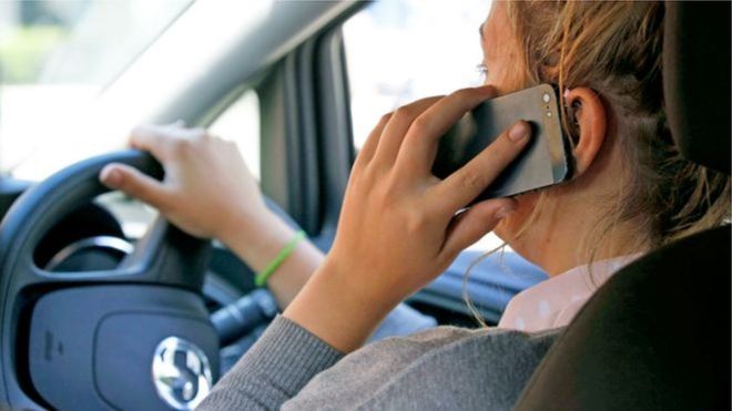 Britain places blanket ban on phone use while driving