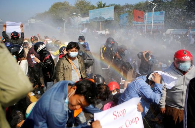 Dozens arrested as Myanmar protesters defy bans and water cannons