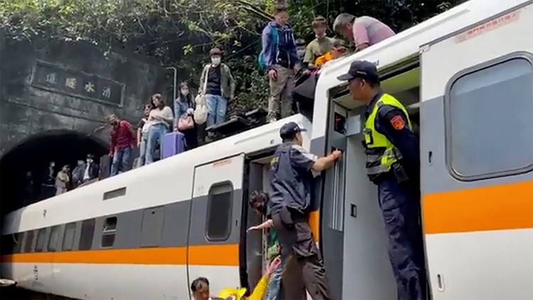 At least 34 killed after train derails inside tunnel in Taiwan