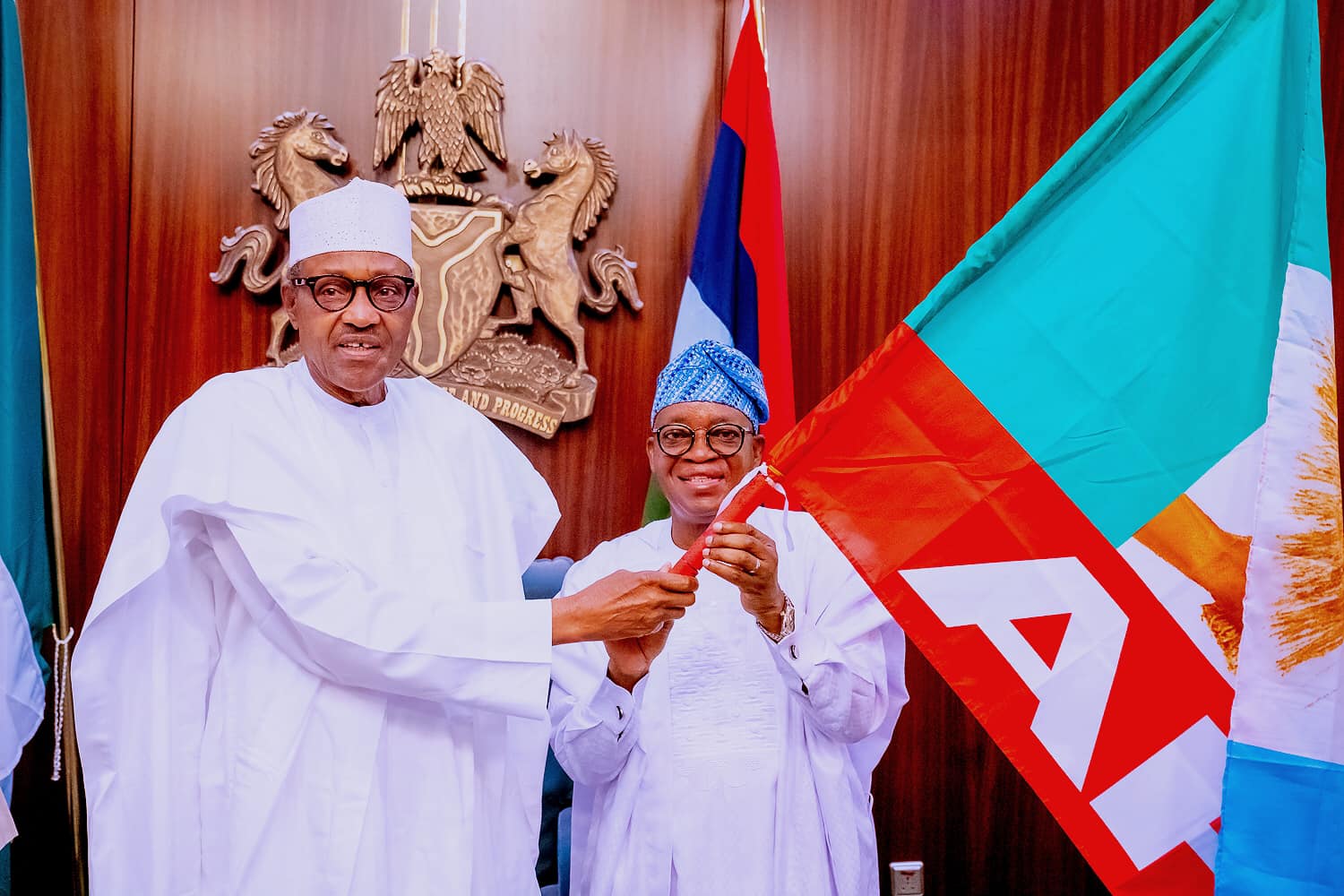 Osun: Buhari presents flag to APC guber candidate, Oyetola