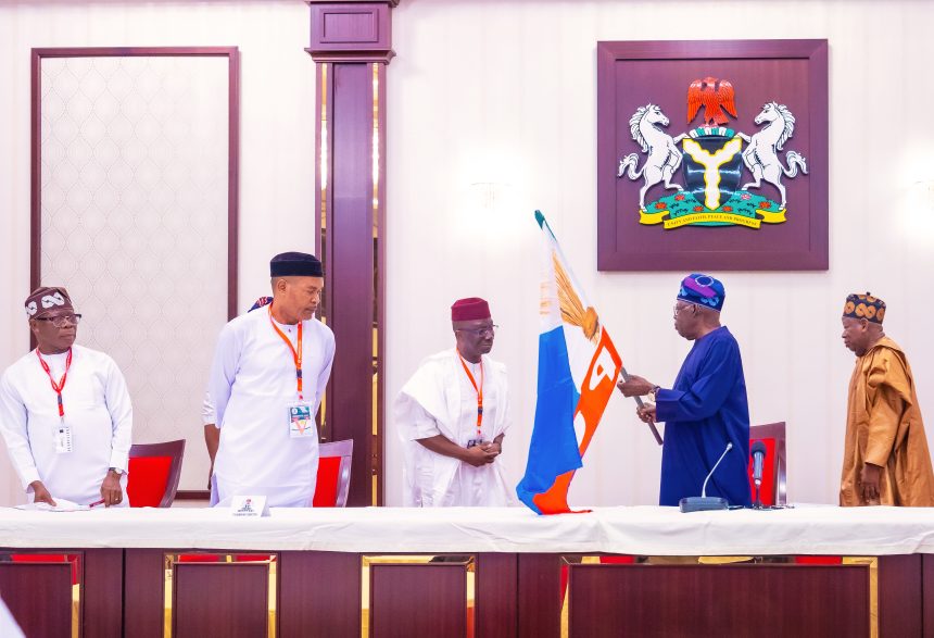 Edo guber: Tinubu presents APC flag to candidate, makes promise