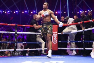 Joshua dedicates victory to late coaches, eyes Fury showdown